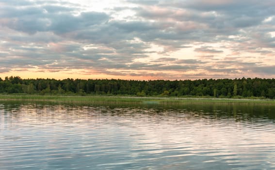 Sunset at wild part of Mikolajskie Lake, Masurian Lake District