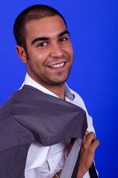 young happy businessman, on a blue background