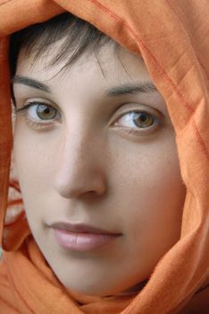 young woman with a veil, close up portrait, studio picture