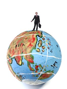 young business man in the top of a globe