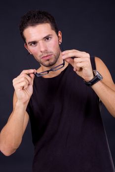 young casual man portrait on a black background