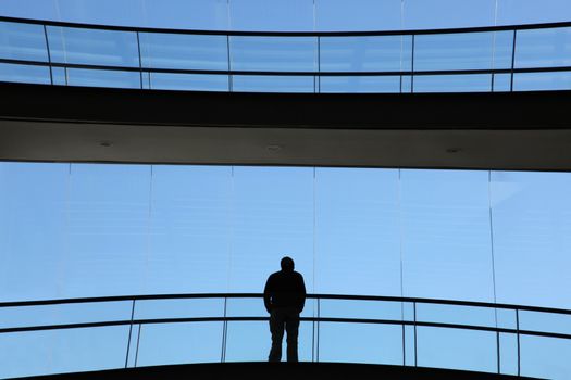 young man inside a modern office building