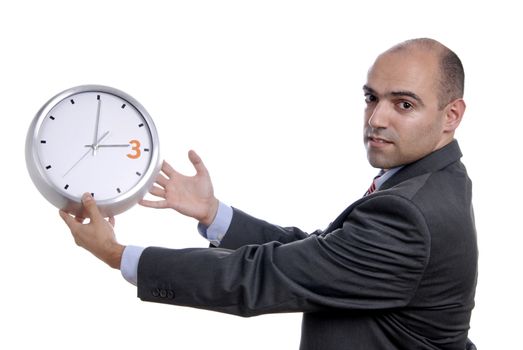 A handsome business man holding a clock