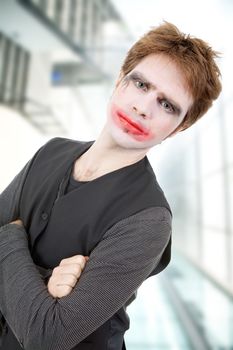 crazy young man dressed as joker