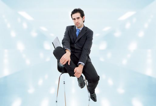 young businessman on a chair at the office