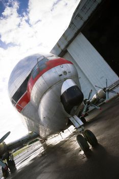 An unusual vintage aiplane rolls out of airport hangar