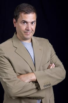 young casual man portrait on a black background