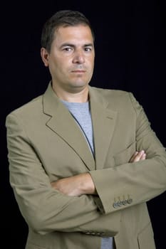 young casual man portrait on a black background