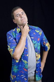 young casual man portrait on a black background