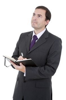 young businessman writing in a book in white background