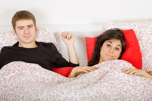 young couple in bed, studio picture