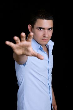 young casual happy man on a black background