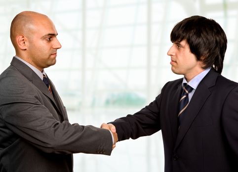 businessmen shaking hands at the office