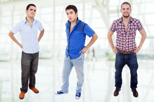 three young casual men standing