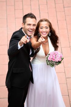 Wedding on the nature, young wedding couple showing