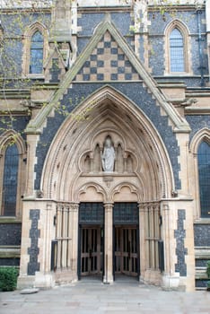 Old massive church door of the catholic church