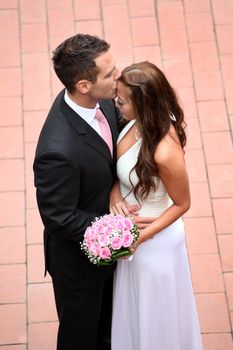 Portrait of a young bride and groom