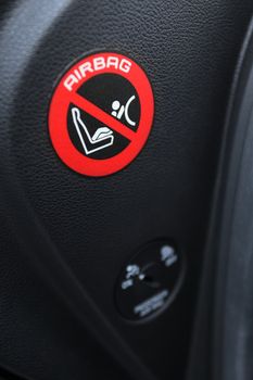 Closeup shot of airbag sign stickers in modern car
