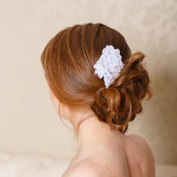 Updo with accessories bride photographed from the back closeup