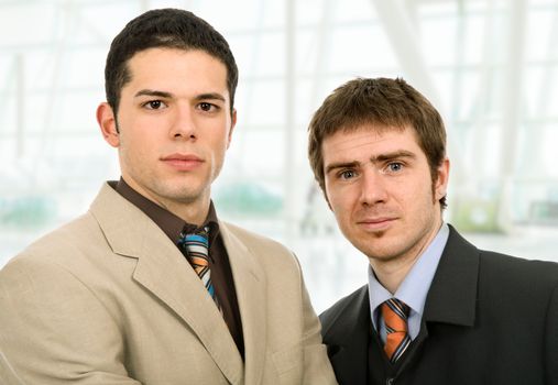 two young business men portrait at the office