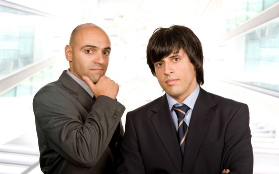 two young business men portrait at the office