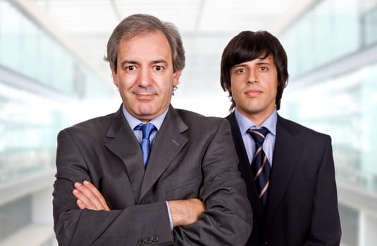 two young business men portrait at the office