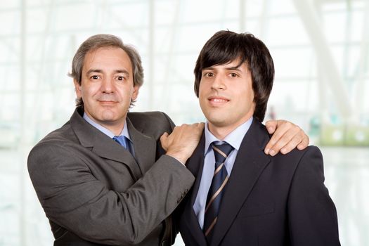 two young business men portrait at the office