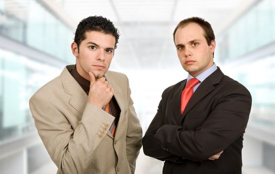 two young business men portrait at the office