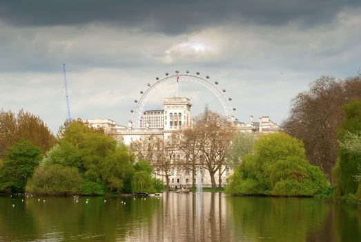 St. James Park lake with Horse Guards and London Eye in the background.