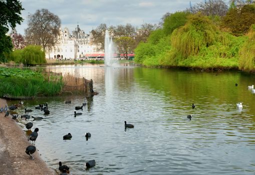 St. James Park lake with Horse Guards and London Eye in the background.