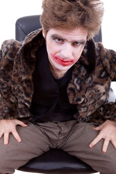 young man dressed as joker, isolated on white