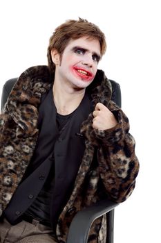 young man dressed as joker, isolated on white