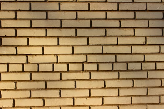 Wall is lined with smooth white brick in classic style
