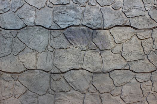 Stones of different sizes stacked on each other in the form of wall