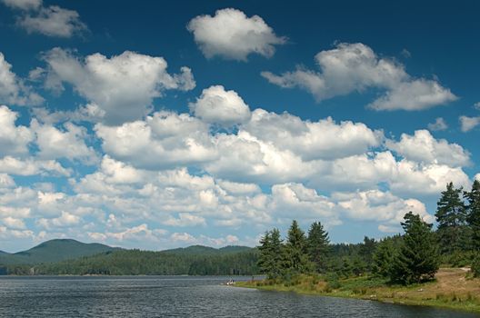 Mountain lake with clody sky