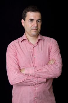 young casual man portrait on a black background