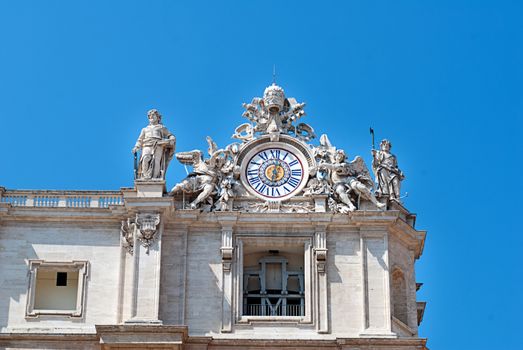 Clock on facade of Saint Peter's basilica in Vatican, Italy