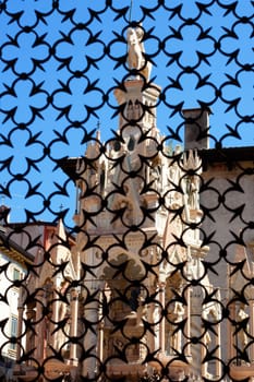 The Cansignorio tomb, one of the gothic Scaliger Tombs in the city of Verona in northern Italy, seen through an iron gate