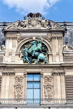 Detail from the facade of the Louvre Museum (Musee du Louvre) in Paris, France