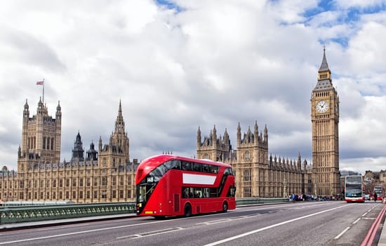 Houses of the British Parliament and red bus