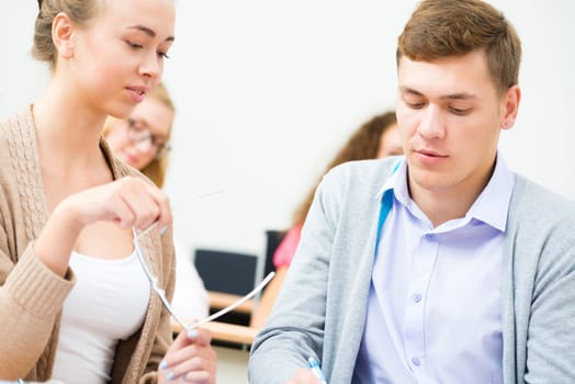 image of a two students in the class talk