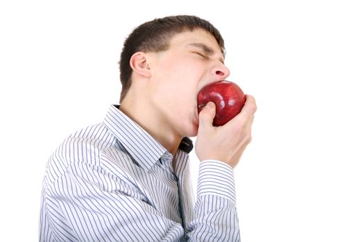 Hungry Teenager eats An Apple Isolated on the White Background