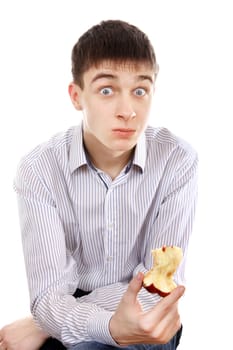 Surprised Teenager sitting with Core of an Apple on the White Background