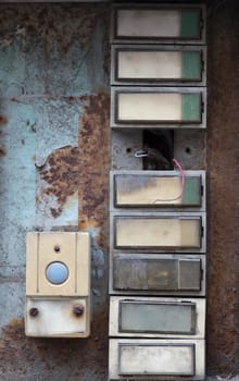 Various of the old and damaged doorbells - buttons