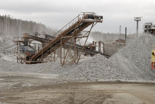 power hydraulic digger working in quarry, caterpillar