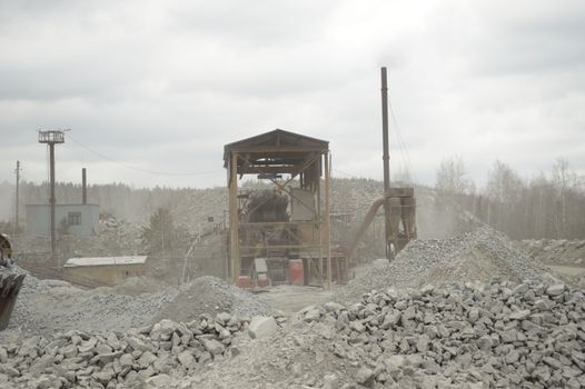 power hydraulic digger working in quarry, caterpillar