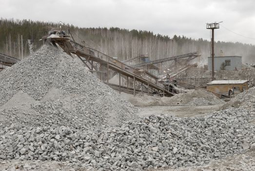 power hydraulic digger working in quarry, caterpillar