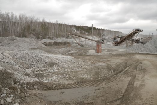 power hydraulic digger working in quarry, caterpillar