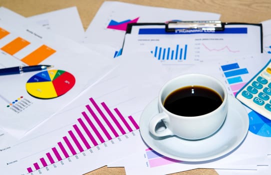 Business documents and pen  placed on desks.