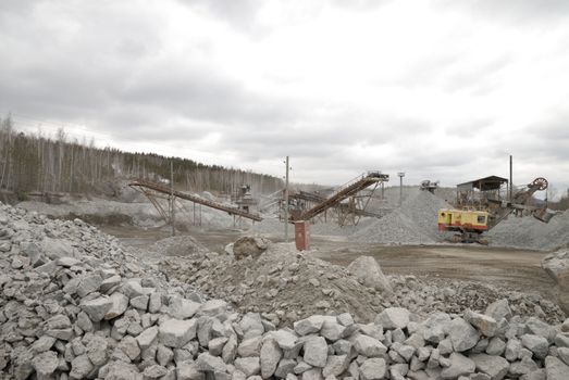 power hydraulic digger working in quarry, caterpillar